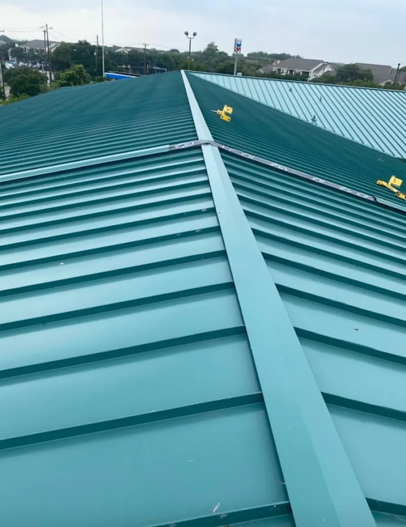 Green commercial metal roof ridge and valley for Metal Roof Repair in Evans